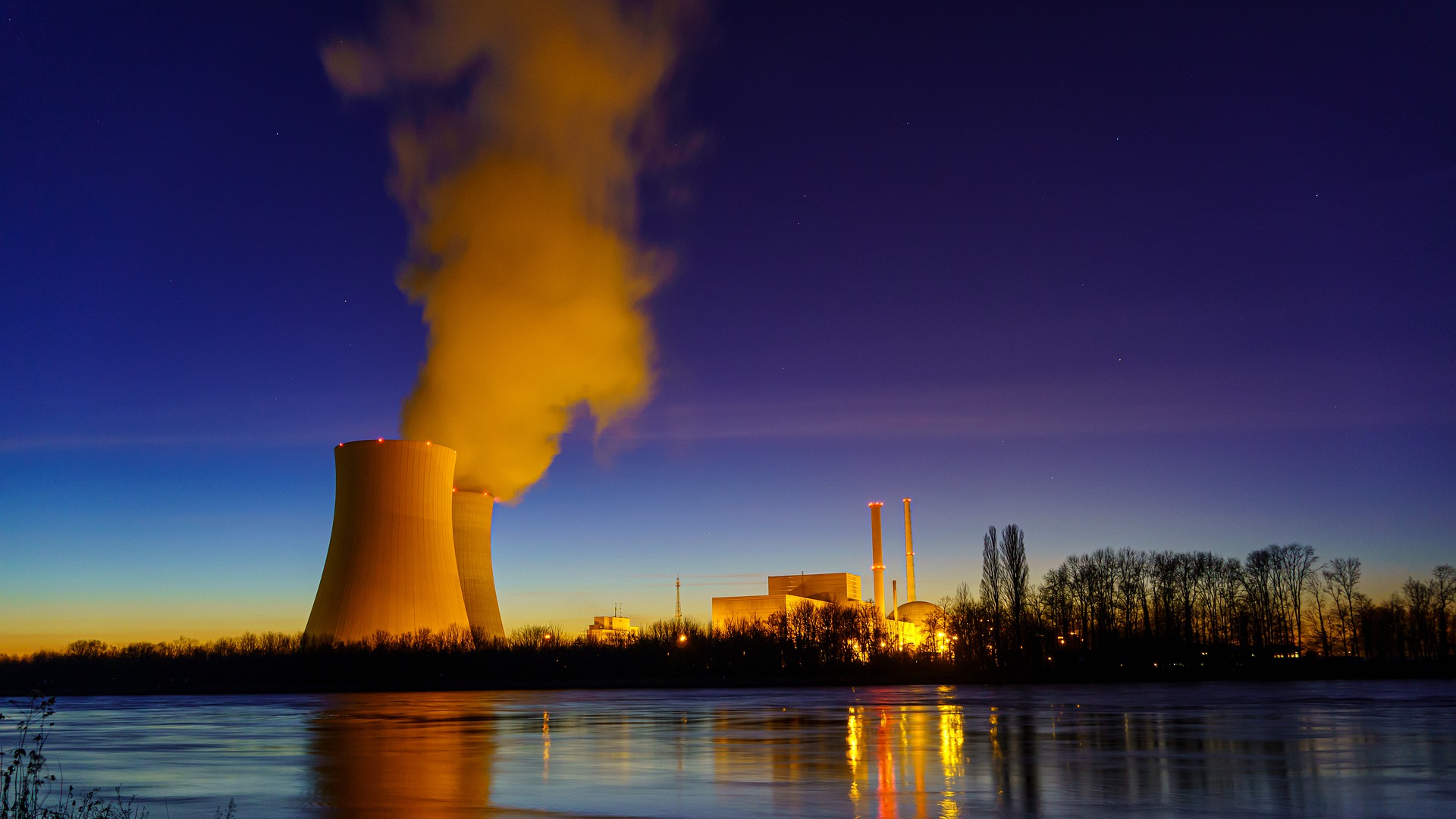 A nuclear power plant located on the Rhine at night.