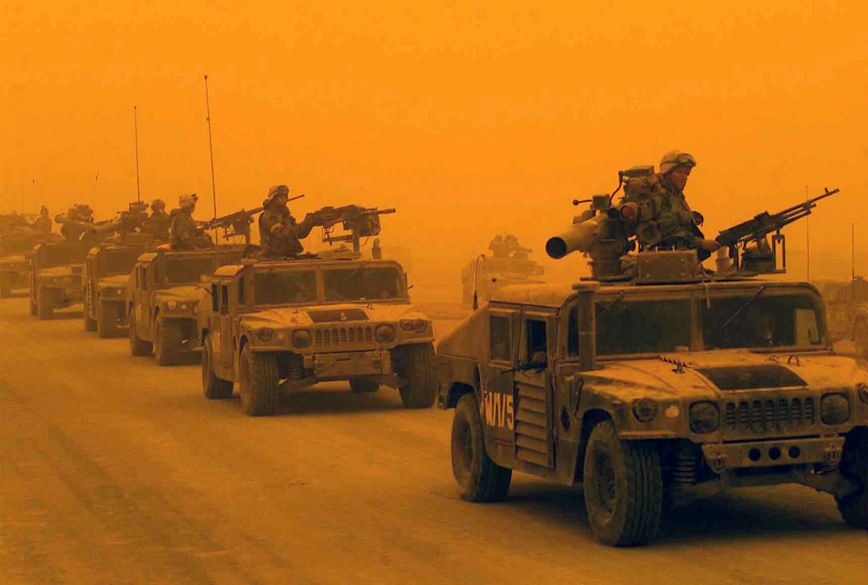 A convoy of U.S. Marines arrive in Northern Iraq during a sandstorm, 2003.
