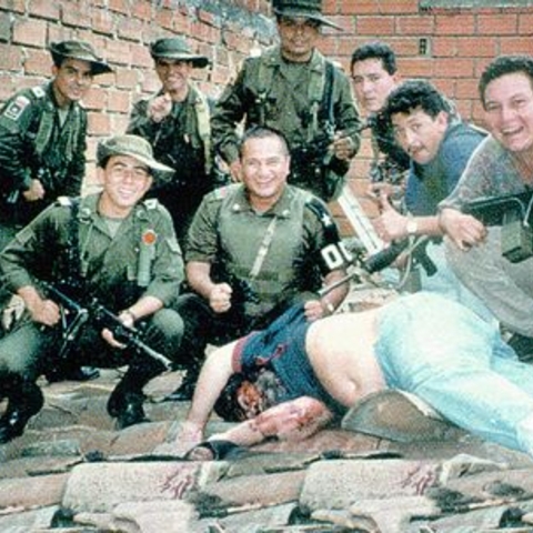 Colombian soldiers pose with the body of Pablo Escobar, the most infamous member of the Medellín cartel, who was killed in 1993 Colombian soldiers pose with the body of Pablo Escobar, the most infamous member of the Medellín cartel, who was killed in 1993
